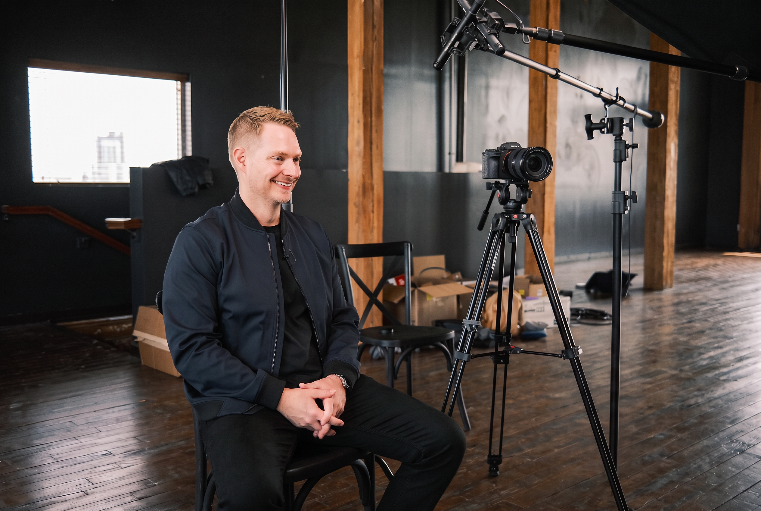 Jason VanRuler seated in a podcast recording studio